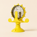 Yellow Treat-Dispensing Cat Toy on a warm ivory studio background